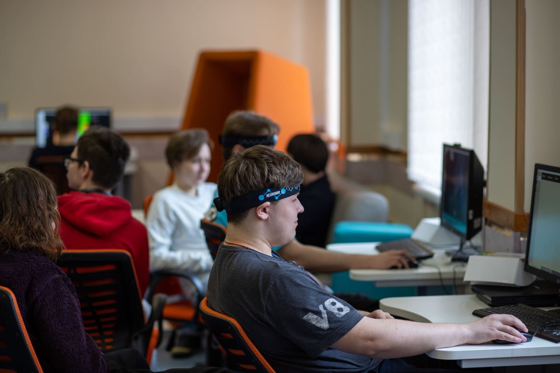 Students working individually at computers in a modern classroom